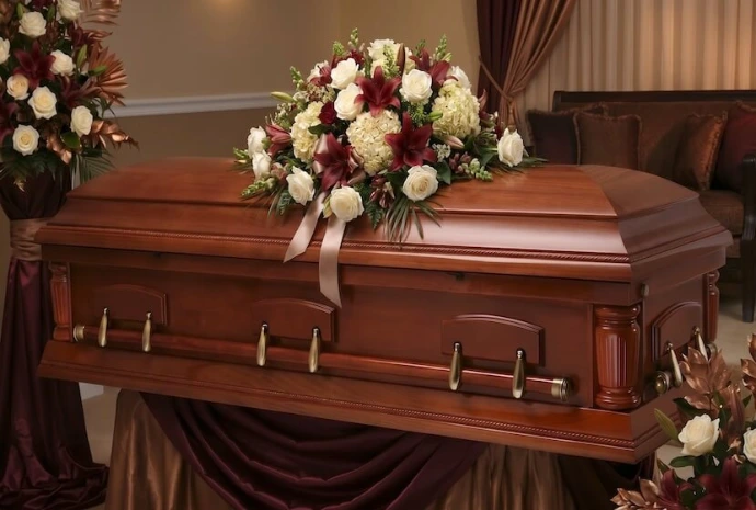 casket with funeral flowers